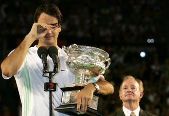 MELBOURNE, AUSTRALIA - JANUARY 29: Roger Federer of Switzerland cries as he collects the trophy after victory in his Men's Singles Final match against Marcos Baghdatis of Cyprus during day fourteen of the Australian Open at Melbourne Park January 29, 2006 in Melbourne, Australia.  (Photo by Phil Walter/Getty Images) 