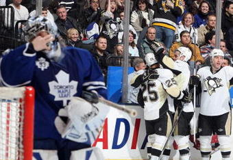 TORONTO - JANUARY 31:  Vesa Toskala #35 of the Toronto Maple Leafs despairs as Maxime Talbot #25, Pascal Dupuis #9 and Rob Scuderi #4 of the Pittsburgh Penguins celebrate a goal during the game at Air Canada Centre on January 31, 2009 in Toronto, Ontario, Canada. (Photo by Dave Sandford/Getty Images)