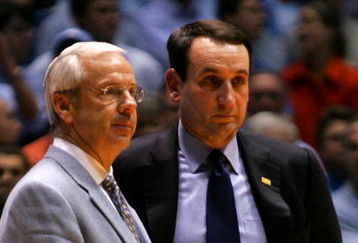 CHAPEL HILL, NC - MARCH 04:  Head coach Mike Krzyzewski (R) of the Duke Blue Devils waits on the officials with head coach Roy Williams of the University of North Carolina Tar Heels after an incident involving Tyler Hansbrough and Gerald Henderson during their game at the Dean E. Smith Center on March 4, 2007 in Chapel Hill, North Carolina. North Carolina defeated Duke, 86 - 72.  (Photo by Streeter Lecka/Getty Images)