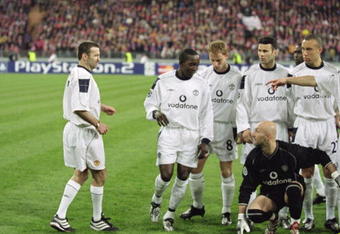 18 Apr 2001:  Karl Power a Manchester United supporter becomes an instant legend as he is spotted by Manchester United players after being in the team group posing as Eric Cantona before the UEFA Champions League Quarter Finals second leg match between Bayern Munich and Manchester United played at the Olympic Stadium, in Munich, Germany. Bayern Munich won the match 2-1, and went through to the semi-finals with a 3-1 aggregate win. \ Mandatory Credit: Shaun Botterill /Allsport