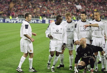 18 Apr 2001:  Karl Power a Manchester United supporter becomes an instant legend as he is spotted by Manchester United players after being in the team group posing as Eric Cantona before the UEFA Champions League Quarter Finals second leg match between Bayern Munich and Manchester United played at the Olympic Stadium, in Munich, Germany. Bayern Munich won the match 2-1, and went through to the semi-finals with a 3-1 aggregate win. \ Mandatory Credit: Shaun Botterill /Allsport