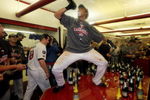 MINNEAPOLIS - OCTOBER 06:  Carlos Gomez #22 of the Minnesota Twins celebrates with teammates in the locker room after the Twins defeated  the Detroit Tigers to win the American League Tiebreaker game on October 6, 2009 at Hubert H. Humphrey Metrodome in Minneapolis, Minnesota.  (Photo by Jamie Squire/Getty Images)