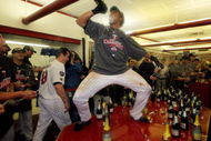 MINNEAPOLIS - OCTOBER 06:  Carlos Gomez #22 of the Minnesota Twins celebrates with teammates in the locker room after the Twins defeated  the Detroit Tigers to win the American League Tiebreaker game on October 6, 2009 at Hubert H. Humphrey Metrodome in Minneapolis, Minnesota.  (Photo by Jamie Squire/Getty Images)