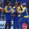 JOHANNESBURG, SOUTH AFRICA - SEPTEMBER 27:  Nuwan Kulasekara (2nd R) of Sri Lanka is congratulated by team mates on the wicket of Jesse Ryder of New Zealand during the ICC Champions Trophy Group B match between New Zealand and Sri Lanka played at Wanderers Stadium on September 27, 2009 in Johannesburg, South Africa.  (Photo by Hamish Blair/Getty Images)
