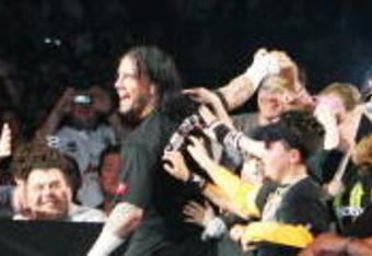 SYDNEY, AUSTRALIA - JUNE 15:  CM Punk celebrates with fans before facing Shelton Benjamin during WWE Smackdown at Acer Arena on June 15, 2008 in Sydney, Australia.  (Photo by Gaye Gerard/Getty Images)