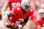COLUMBUS, OH - SEPTEMBER 27: Quarterback Terrelle Pryor #2 of the  Ohio State Buckeyes nearly loses control of the football on a run as Traye Simmons #15 of the Minnesota Golden Gophers closes in on September 27, 2008 at Ohio Stadium in Columbus, Ohio.  Pryor rushed for two touchdowns and threw for one more in the Buckeyes' 34-21 win.  (Photo by Jamie Sabau/Getty Images)