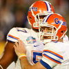 MIAMI - JANUARY 08:  Tim Tebow #15 (R) and Carl Johnson #57 of the Florida Gators celebrate after Tebow threw a 20-yard touchdown pass to Louis Murphy #9 in the second quarter against the Oklahoma Sooners during the FedEx BCS National Championship game at Dolphin Stadium on January 8, 2009 in Miami, Florida.  (Photo by Marc Serota/Getty Images)