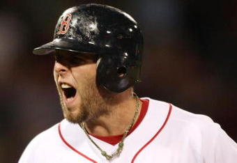 BOSTON - SEPTEMBER 29:  Dustin Pedroia #15 of the Boston Red Sox reacts after flying out in the ninth inning against the Toronto Blue Jays on September 29, 2009 at Fenway Park in Boston, Massachusetts.The Blue Jays defeated the Red Sox 8-7.  (Photo by Elsa/Getty Images)