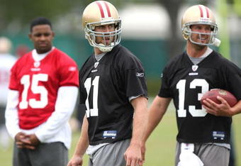 SANTA CLARA, CA - MAY 01:  Michael Crabtree #15 of the San Francisco 49ers looks on during practice as quaterback Alex Smith #11 and Shaun Hill #13 practice during the 49ers Minicamp at their training facilities on May 1, 2009 in Santa Clara, California. (Photo by Jed Jacobsohn/Getty Images)