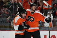 PHILADELPHIA - OCTOBER 06: Mike Richards #18 (L) of the Phildelphia Flyers is hugged by Chris Pronger #20 (R) after his second period goal against the Washington Capitals at the Wachovia Center on October 6, 2009 in Philadelphia, Pennsylvania. (Photo by Bruce Bennett/Getty Images)