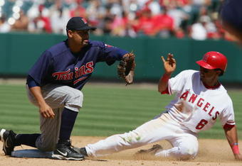 ANAHEIM, CA - JULY 6:   Maicer Izturis #6 of the Los Angeles Angels of Anaheim is safe at second base in the 7th inning against Luis Rivas #2 of the Minnesota Twins on July 6, 2005 at Angel Stadium in Anaheim, California.  The Angels won 7-6. (Photo by Lisa Blumenfeld/Getty Images)