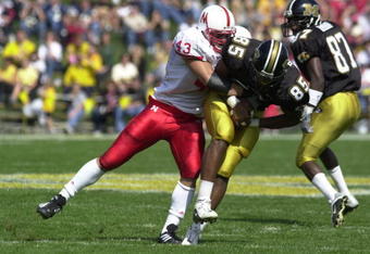 29 Sep 2001: Ben Davidson #43 of Nebraska tackles Casey Nelson #85 of Missouri at Faurot Field in Columbia, Missouri. The Nebraska Cornhuskers beat the Missouri Tigers 36-3. DIGITAL IMAGE. Mandatory Credit: Elsa/ALLSPORT