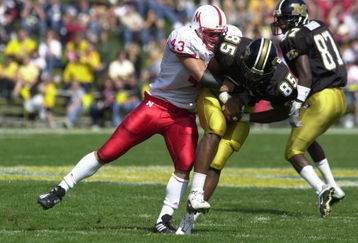 29 Sep 2001: Ben Davidson #43 of Nebraska tackles Casey Nelson #85 of Missouri at Faurot Field in Columbia, Missouri. The Nebraska Cornhuskers beat the Missouri Tigers 36-3. DIGITAL IMAGE. Mandatory Credit: Elsa/ALLSPORT