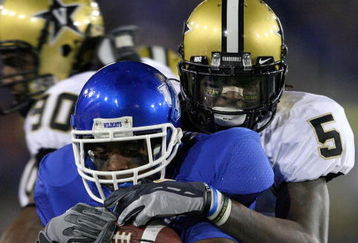 LEXINGTON, KY - NOVEMBER 15: E.J. Adams #17 of the Kentucky Wildcats is tackled by Myron Lewis #5 of the Vanderbilt Commodores during the game on November 15, 2008 at Commonwealth Stadium in Lexington, Kentucky.  (Photo by Andy Lyons/Getty Images)