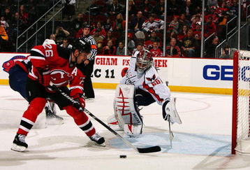 NEWARK, NJ - NOVEMBER 15:  Jose theodore #60 of the Washington Capitals defends the goal against Patrik Elias #26 of the New Jersey Devils during their game on November 15, 2008 at the Prudential Center in Newark, New Jersey  (Photo by Al Bello/Getty Images)