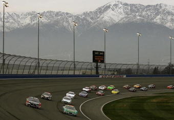 FONTANA, CA - FEBRUARY 21:  Carl Edwards, driver of the #60 Scotts Ford, and Kyle Busch, driver of the #18 Z-Line Designs Toyota lead the field during the NASCAR Nationwide Series Stater Bros. 300 at Auto Club Speedway on February 21, 2009 in Fontana, California.  (Photo by Jason Smith/Getty Images for NASCAR)