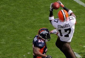 DENVER - SEPTEMBER 20:  Braylon Edwards #17 of the Cleveland Browns makes a reception as Brain Dawkins #20 and Renaldo Hill #23 of the Denver Broncos defend during NFL action at Invesco Field at Mile High on September 20, 2009 in Denver, Colorado. The Broncos defeated the Browns 27-6.  (Photo by Doug Pensinger/Getty Images)
