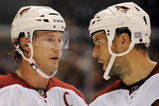 LOS ANGELES, CA - OCTOBER 03:  Shane Doan #19 and Adrian Aucoin #33 of the Phoenix Coyotes discuss a play against the Los Angeles Kings during thee game at the Staples Center on October 3, 2009 in Los Angeles, California.  (Photo by Harry How/Getty Images)