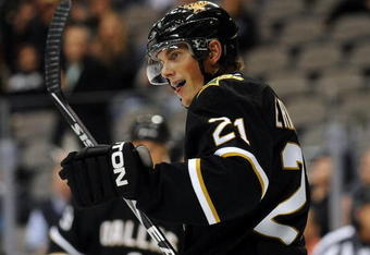 DALLAS - SEPTEMBER 16:  Left wing Loui Eriksson #21 of the Dallas Stars celebrates a goal by James Neal against the Tampa Bay Lightning at American Airlines Center on September 16, 2009 in Dallas, Texas.  (Photo by Ronald Martinez/Getty Images)