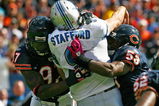 CHICAGO - OCTOBER 04: Mark Anderson #97 and Nick Roach #53 of the Chicago Bears hit Matthew Stafford #9 of the Detroit Lions after a pass on October 4, 2009 at Soldier Field in Chicago, Illinois. The Bears defeated the Lions 48-24. (Photo by Jonathan Daniel/Getty Images)