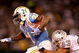 OAKLAND, CA - SEPTEMBER 14:  LaDainian Tomlinson #21 of the San Diego Chargers is tackled by Tyvon Branch #33 of the Oakland Raiders during their game on September 14, 2009 at the Oakland-Alameda County Coliseum in Oakland, California.  (Photo by Ezra Shaw/Getty Images)
