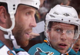 GLENDALE, AZ - SEPTEMBER 26:  Dany Heatley #15 of the San Jose Sharks talks with Joe Thornton #19 on the bench during the preseason NHL game against the Phoenix Coyotes at Jobing.com Arena on September 26, 2009 in Glendale, Arizona.  The Coyotes defeated the Sharks 2-0.  (Photo by Christian Petersen/Getty Images)