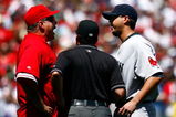 ANAHEIM, CA - APRIL 12:  Los Angeles Angels of Anaheim manager Mike Scioscia (L) is seperated by umpire Ed Rapuano while arguing with pitcher Josh Beckett #19 of the Boston Red Sox in the first inning at Angel Stadium on April 12, 2009 in Anaheim, California.  The Angels defeated the Red Sox 5-4.  (Photo by Jeff Gross/Getty Images)