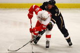 STOCKHOLM, SWEDEN - OCTOBER 03:  #40 Henrik Zetterberg of Detroit Red Wings battles for the puck with #43 Erik Johnson of St. Louis Blues during the 2009 Compuware NHL Premiere Stockholm match between St. Louis Blues and Detroit Red Wings at the Ericsson Globe on October 3, 2009 in Stockholm, Sweden.  (Photo by Paul Gilham/Getty Images)