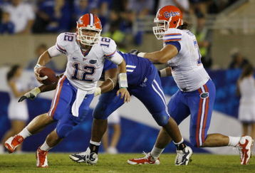 LEXINGTON, KY - SEPTEMBER 26:   Quarterback John Brantley #12 of the Florida Gators carries the ball in the fourth quarter of the game against the Kentucky Wildcats at Commonwealth Stadium on September 26, 2009 in Lexington, Kentucky.  The Gators won 41-7. (Photo by Andy Lyons/Getty Images)