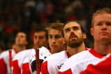 STOCKHOLM, SWEDEN - OCTOBER 03:  #40 Henrik Zetterberg of Detroit Red Wings looks on during the Swedish and United States national anthems during the 2009 Compuware NHL Premiere Stockholm match between St. Louis Blues and Detroit Red Wings at the Ericsson Globe on October 3, 2009 in Stockholm, Sweden.  (Photo by Paul Gilham/Getty Images)