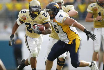 JACKSONVILLE, FL - JANUARY 01:  Running back Tashard Choice #22 of the Georgia Tech Yellow Jackets runs through nose tackle Keilen Dykes #96  of the West Virginia Mountaineers defense in the Toyota Gator Bowl at Alltel Stadium January 1, 2007 in Jacksonville, Florida.  (Photo by Marc Serota/Getty Images)