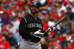 PHILADELPHIA - OCTOBER 07:  Todd Helton #17 of the COlorado Rockies walks bakc to the dugout after he committed an out against the Philadelphia Phillies  in Game One of the NLDS during the 2009 MLB Playoffs at Citizens Bank Park on October 7, 2009 in Philadelphia, Pennsylvania.  (Photo by Chris McGrath/Getty Images)