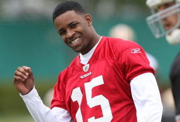 SANTA CLARA, CA - MAY 01:  Michael Crabtree #15 of the San Francisco 49ers looks on during practice as quaterback Alex Smith #11 practices during the 49ers Minicamp at their training facilities on May 1, 2009 in Santa Clara, California. Crabtree was the 49ers first round draft pick.  (Photo by Jed Jacobsohn/Getty Images)