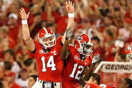 ATHENS, GA - SEPTEMBER 12: Quarterback Joe Cox #14 and Tavarres King #12 celebrate a touchdown against the Georgia Bulldogs of the South Carolina Gamecocks at Sanford Stadium on September 12, 2009 in Athens, Georgia. (Photo by Kevin C. Cox/Getty Images)