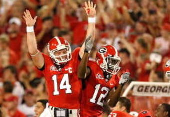ATHENS, GA - SEPTEMBER 12:  Quarterback Joe Cox #14 and Tavarres King #12 celebrate a touchdown against the Georgia Bulldogs of the South Carolina Gamecocks at Sanford Stadium on September 12, 2009 in Athens, Georgia.  (Photo by Kevin C. Cox/Getty Images)