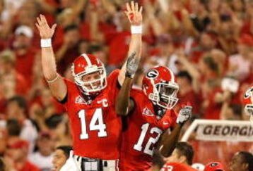 ATHENS, GA - SEPTEMBER 12:  Quarterback Joe Cox #14 and Tavarres King #12 celebrate a touchdown against the Georgia Bulldogs of the South Carolina Gamecocks at Sanford Stadium on September 12, 2009 in Athens, Georgia.  (Photo by Kevin C. Cox/Getty Images)