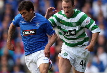 GLASGOW, SCOTLAND - OCTOBER 4: Aiden McGeady of Celtic and Nacho Novo of Rangers in action during the  Clydesdale Bank Scottish Premier League match between Rangers and Celtic at Ibrox on October 4, 2009 in Glasgow, Scotland. (Photo by Ian MacNicol/Getty Images)