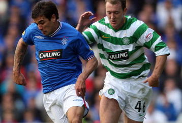 GLASGOW, SCOTLAND - OCTOBER 4: Aiden McGeady of Celtic and Nacho Novo of Rangers in action during the  Clydesdale Bank Scottish Premier League match between Rangers and Celtic at Ibrox on October 4, 2009 in Glasgow, Scotland. (Photo by Ian MacNicol/Getty Images)