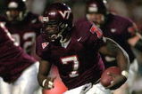 12 Oct 2000:  Michael Vick #7 of the Virginia Tech Hokies moves with the ball during the game against the West Virginia Volunteers in Blacksburg, Virginia. The Hokies defeated the Volunteers 48-20.Mandatory Credit: Scott Halleran  /Allsport