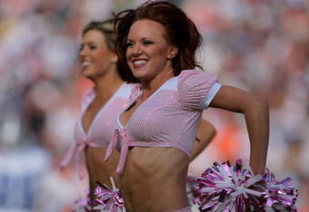 DENVER - OCTOBER 04:  The Denver Broncos cheerleaders perform during a break in the action against the Dallas Cowboys during NFL action at Invesco Field at Mile High on October 4, 2009 in Denver, Colorado. The Broncos defeated the Cowboys 17-10. The cheerleaders were clad in pink as part of the NFL's breast cancer awareness program 'A Crucial Catch'  (Photo by Doug Pensinger/Getty Images)