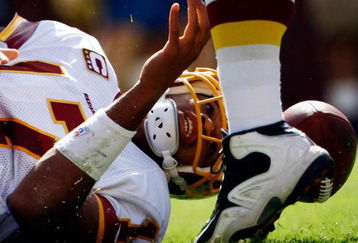 LANDOVER, MD - SEPTEMBER 20:  Quarterback Jason Campbell #17 of the Washington Redskins loses the football near the goal line but later recovered it against the St. Louis Rams during their game on September 20, 2009 at FedEx Field in Landover, Maryland.  The Redskins defeated the Rams by a score of 9-7.  (Photo by Win McNamee/Getty Images)