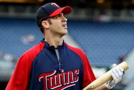 NEW YORK - OCTOBER 07:  Joe Mauer #7 of the Minnesota Twins looks on during batting practice before Game One of the ALDS against the New York Yankees during the 2009 MLB Playoffs at Yankee Stadium on October 7, 2009 in the Bronx borough of New York City.  (Photo by Jim McIsaac/Getty Images)