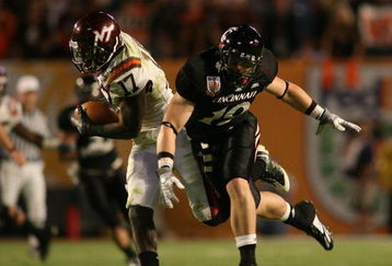 MIAMI - JANUARY 01:  Kam Chancellar #17 intercepts the ball against Ben Guidugli #19 of the Virginia Tech Hokies of the Virginia Tech Hokies Cincinnati Bearcats during the FedEx Orange Bowl at Dolphin Stadium on January 1, 2009 in Miami, Florida.  (Photo by Marc Serota/Getty Images)