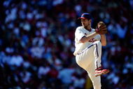 PHILADELPHIA - OCTOBER 07:  Starting pitcher Cliff Lee #34 of the Philadelphia Phillies throws a pitch against the Colorado Rockies in Game One of the NLDS during the 2009 MLB Playoffs at Citizens Bank Park on October 7, 2009 in Philadelphia, Pennsylvania.  (Photo by Jeff Zelevansky/Getty Images)