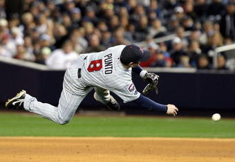 NEW YORK - OCTOBER 07:  Nick Punto #8 of the Minnesota Twins throws to first base to make an out against the New York Yankees in Game One of the ALDS during the 2009 MLB Playoffs at Yankee Stadium on October 7, 2009 in the Bronx borough of New York City.  (Photo by Nick Laham/Getty Images)