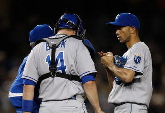 NEW YORK - SEPTEMBER 29:  Juan Cruz #37, John Buck #14, and pitching coach Bob McClure #33 of the Kansas City Royals talk on the mound against the New York Yankees during the game on September 29, 2009 at Yankee Stadium in the Bronx borough of New York City.  (Photo by Jared Wickerham/Getty Images)