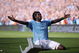 MANCHESTER, ENGLAND - SEPTEMBER 12: Emmanuel Adebayor of Manchester City celebrates in front of the Arsenal fans after scoring during the Barclays Premier League match between Manchester City and Arsenal at the City of Manchester Stadium on September 12, 2009 in Manchester, England. (Photo by Shaun Botterill/Getty Images)