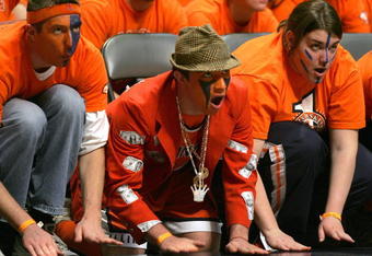 CHAMPAIGN, IL - FEBRUARY 12:  Fans of the Illinois Fighting Illini beat on the floor as a member of the Wisconsin Badgers shoots a free-throw on February 12, 2005 at the Assembly Hall at the University of Illinois in Champaign, Illinois. Illinois defeated Wisconsin 70-59.  (Photo by Jonathan Daniel/Getty Images)