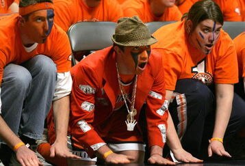 CHAMPAIGN, IL - FEBRUARY 12:  Fans of the Illinois Fighting Illini beat on the floor as a member of the Wisconsin Badgers shoots a free-throw on February 12, 2005 at the Assembly Hall at the University of Illinois in Champaign, Illinois. Illinois defeated Wisconsin 70-59.  (Photo by Jonathan Daniel/Getty Images)