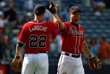 ATLANTA - AUGUST 23:  Chipper Jones #10 and Adam LaRoche #22 of the Atlanta Braves celebrate their 7-5 win over the Florida Marlins on August 23, 2009 at Turner Field in Atlanta, Georgia.  (Photo by Kevin C. Cox/Getty Images)